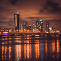 Fototapeta na wymiar miami city night water lights sea buildings bridge