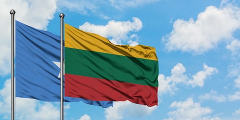 Somalia and Lithuania flag waving in the wind against white cloudy blue sky together. Diplomacy concept, international relations.