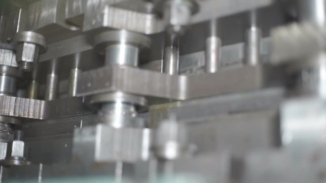 The process of processing metal billets in old machine tools of heavy engineering plants. Moving parts of processing machines