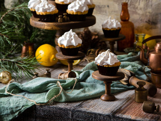 lemon cupcakes with whipped meringue on wooden cake stands 
