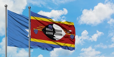 Somalia and Swaziland flag waving in the wind against white cloudy blue sky together. Diplomacy concept, international relations.