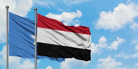 Somalia and Yemen flag waving in the wind against white cloudy blue sky together. Diplomacy concept, international relations.