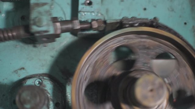 The process of processing metal billets in old machine tools of heavy engineering plants. Moving parts of processing machines