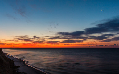 Fototapeta na wymiar Sunrise at coast of the sea. Black Sea. Summer 2019 Ukraine