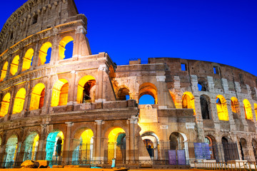 Naklejka premium Night view of Colosseum in Rome, Italy. Rome architecture and landmark. Rome Colosseum is one of the main attractions of Rome and Italy