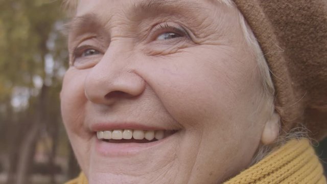 Close-up of happy old lady woman smiling with healthy teeth, elderly dental care