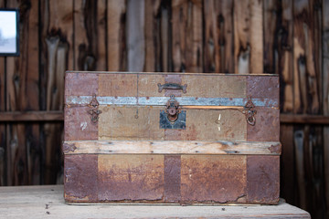 Old retro wooden chest and vintage grunge suitcase