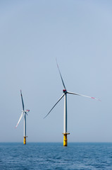 Offshore wind farm with two wind mills in the north sea.