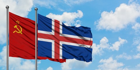 Soviet Union and Iceland flag waving in the wind against white cloudy blue sky together. Diplomacy concept, international relations.