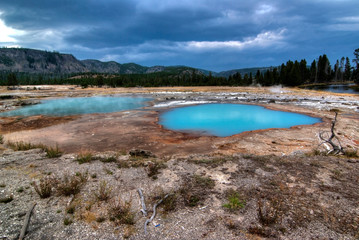 Yellowstone opal blue lake and hot springs on a cloudy day 