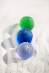 sea glass on white sand beach