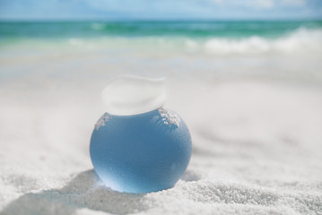 Fototapeta na wymiar sea glass on white sand beach