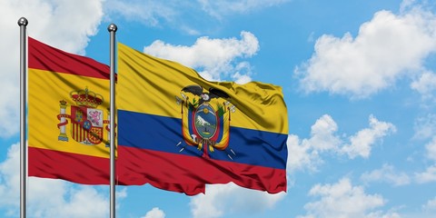 Spain and Ecuador flag waving in the wind against white cloudy blue sky together. Diplomacy concept, international relations.