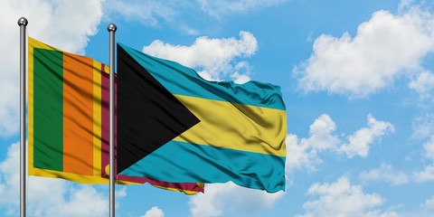 Sri Lanka and Bahamas flag waving in the wind against white cloudy blue sky together. Diplomacy concept, international relations.