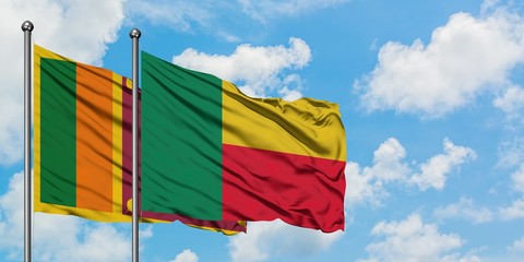 Sri Lanka and Benin flag waving in the wind against white cloudy blue sky together. Diplomacy concept, international relations.