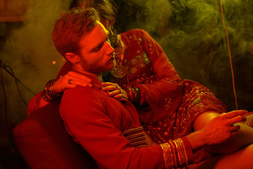 A young man cuddles with an attractive girl. Cinematic style, creative color