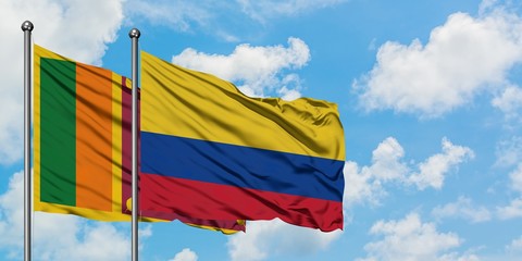 Sri Lanka and Colombia flag waving in the wind against white cloudy blue sky together. Diplomacy concept, international relations.