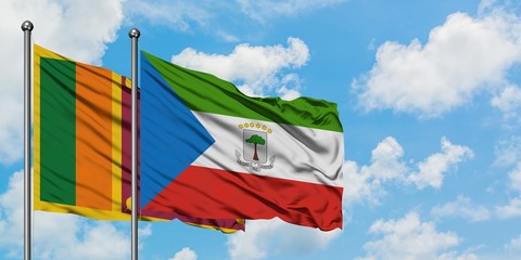 Sri Lanka and Equatorial Guinea flag waving in the wind against white cloudy blue sky together. Diplomacy concept, international relations.