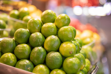 Fresh juicy limes on street market