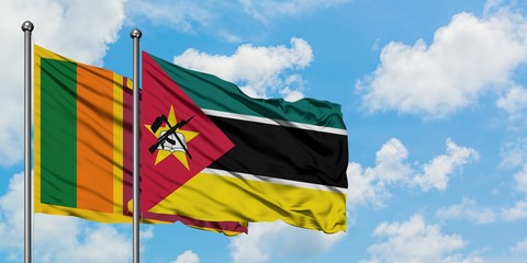 Sri Lanka and Mozambique flag waving in the wind against white cloudy blue sky together. Diplomacy concept, international relations.