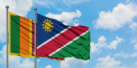 Sri Lanka and Namibia flag waving in the wind against white cloudy blue sky together. Diplomacy concept, international relations.