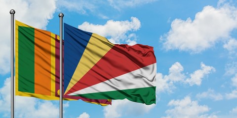 Sri Lanka and Seychelles flag waving in the wind against white cloudy blue sky together. Diplomacy concept, international relations.