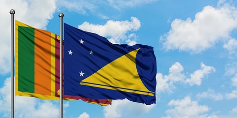 Sri Lanka and Tokelau flag waving in the wind against white cloudy blue sky together. Diplomacy concept, international relations.