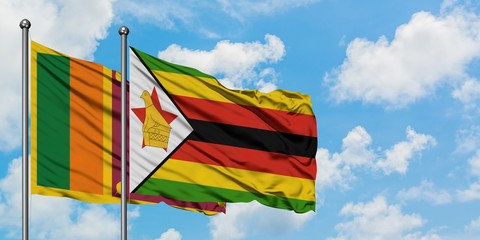 Sri Lanka and Zimbabwe flag waving in the wind against white cloudy blue sky together. Diplomacy concept, international relations.