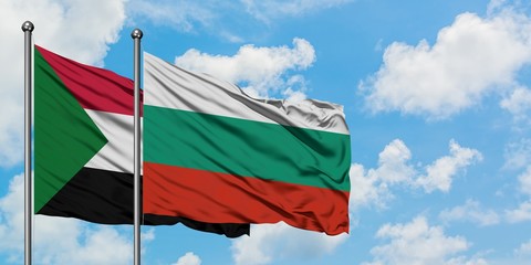 Sudan and Bulgaria flag waving in the wind against white cloudy blue sky together. Diplomacy concept, international relations.