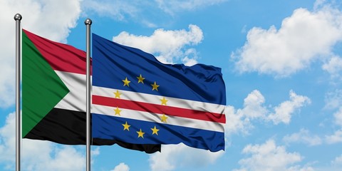 Sudan and Cape Verde flag waving in the wind against white cloudy blue sky together. Diplomacy concept, international relations.