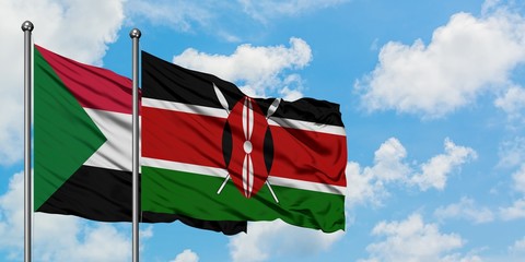 Sudan and Kenya flag waving in the wind against white cloudy blue sky together. Diplomacy concept, international relations.