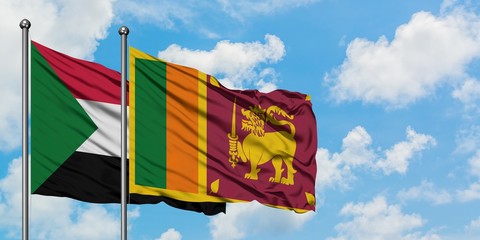 Sudan and Sri Lanka flag waving in the wind against white cloudy blue sky together. Diplomacy concept, international relations.