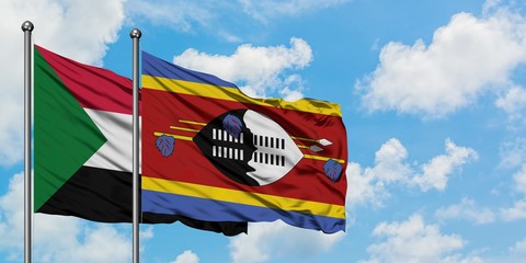 Sudan and Swaziland flag waving in the wind against white cloudy blue sky together. Diplomacy concept, international relations.