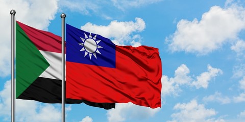Naklejka na ściany i meble Sudan and Taiwan flag waving in the wind against white cloudy blue sky together. Diplomacy concept, international relations.