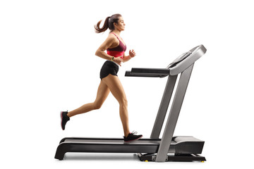 Young woman exercising on a treadmill