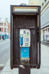 Old public telephone on the street in Dublin, Ireland.