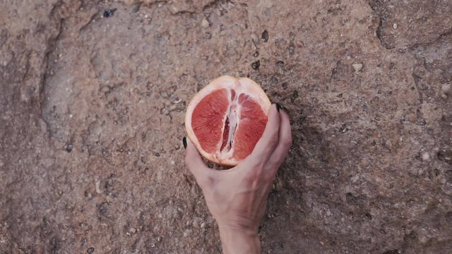 grapefruit In a female hand. isolated