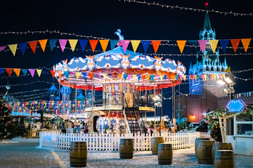 Moscow. Russia. Carousel on red square. Red square is decorated for Christmas. New year's eve near...