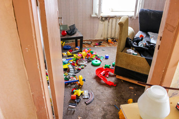 Old abandoned house before demolition, abandoned children's toys