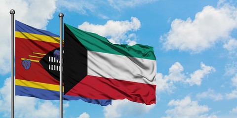 Swaziland and Kuwait flag waving in the wind against white cloudy blue sky together. Diplomacy concept, international relations.