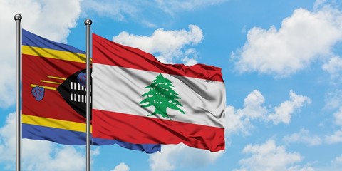 Swaziland and Lebanon flag waving in the wind against white cloudy blue sky together. Diplomacy concept, international relations.