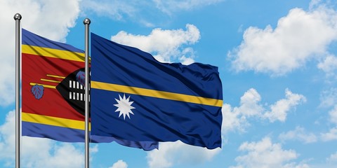 Swaziland and Nauru flag waving in the wind against white cloudy blue sky together. Diplomacy concept, international relations.