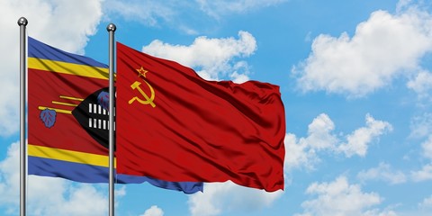 Swaziland and Soviet Union flag waving in the wind against white cloudy blue sky together. Diplomacy concept, international relations.