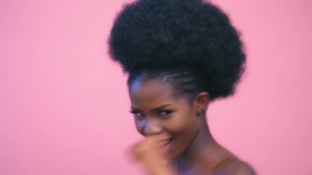 Sexy Pretty Afro-american model boxing smiling and posing pink background