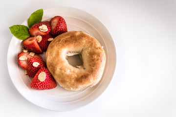 Healthy Bagel and Strawberry Breakfast with Almonds