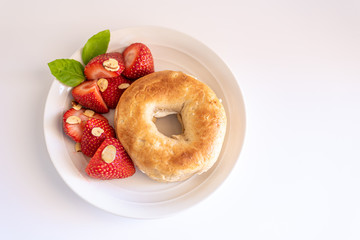 Healthy Bagel and Strawberry Breakfast with Almonds
