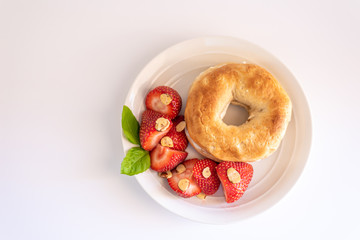 Healthy Bagel and Strawberry Breakfast with Almonds