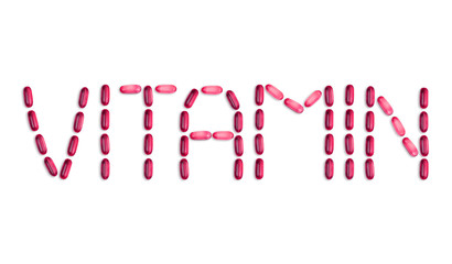 The word Vitamin is laid out with pills. The word Vitamin is laid out with gel pills on a white background with copy space for text