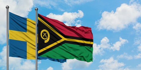 Sweden and Vanuatu flag waving in the wind against white cloudy blue sky together. Diplomacy concept, international relations.