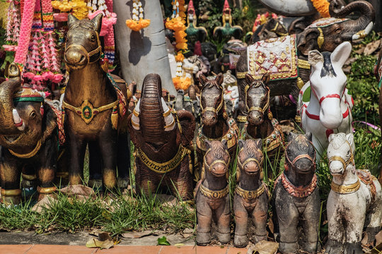 Animal statues decorated with flowers located near the Phra Nakhon Si Ayutthaya Provincial City Pillar Shrine. It is a small and mostly overseen temple in the historic district of Ayutthaya, Thailand.
